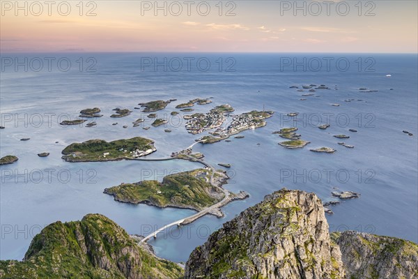 View of fishing village Henningsvaer from the top of Festvagtinden