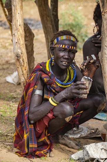 Traditional dressed women smoking