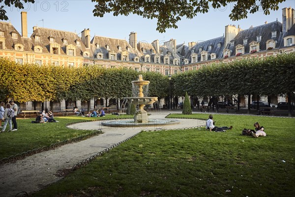 Evening atmosphere with fountains in front of medieval facades