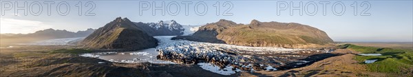 Glacial river in front of Mountains with Hvannadalshnukur