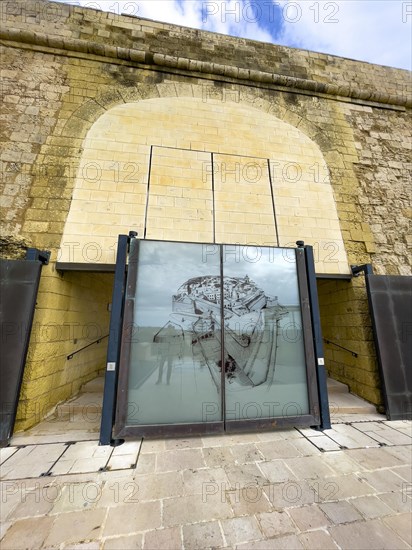 Entrance of Gozo Citadel with display board with map