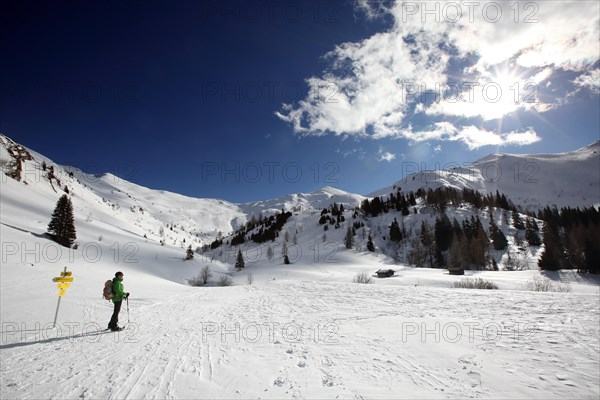 Woman on snowshoe tour at Lake Obernberg