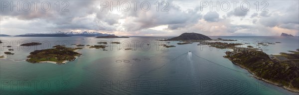 View over the sea with fish farms to Baltsfjorden and the mountains of Balten