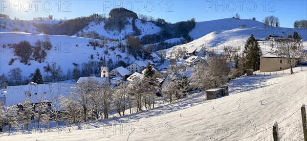 Winter village view with church