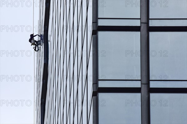 Man cleaning window pane