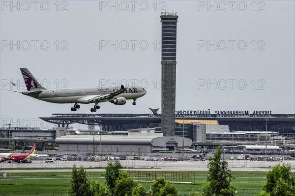 Air traffic control tower Suvarnabhumi Airport and aircraft Qatar Airways Airbus A330-300