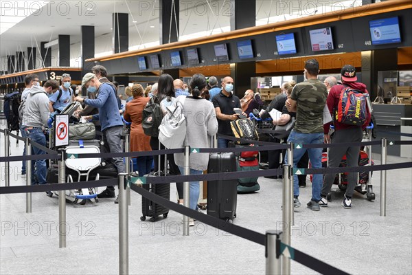 Passengers checking in at Zurich Airport