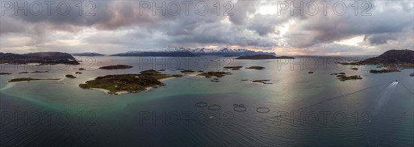 View over the sea with fish farms to Baltsfjorden and the mountains of Balten