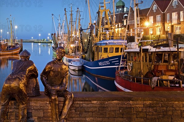 Fishing harbour in the evening with old and young fishermen