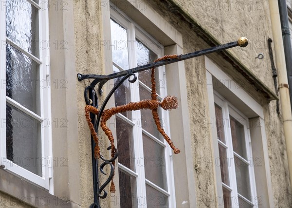 Figure on the facade of the Speichergalerie in the Schnoor