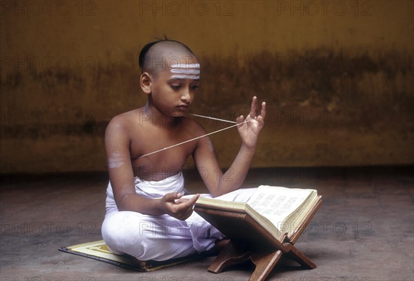 Indian boy reciting vedas