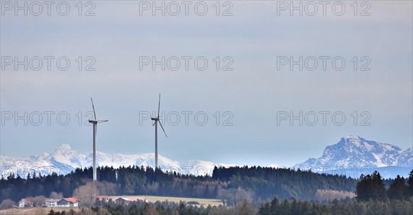 Wind turbines against the backdrop of the Alps