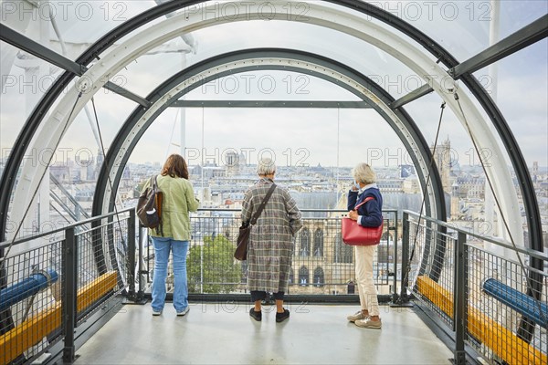 Visitors to the Centre Pompidou in the tubular corridors of the cultural centre overlook the metropolis Centre Georges Pompidou