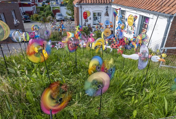 Wind chimes in front of a shop for stunt kites and more at the harbour of Greetsiel