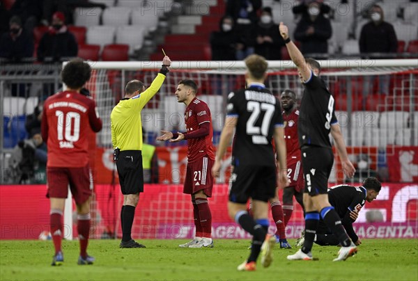 Referee Marco Fritz shows Lucas Hernandez FC Bayern Munich FCB 21 yellow card