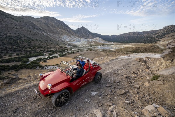 Red beach buggy on sandy track