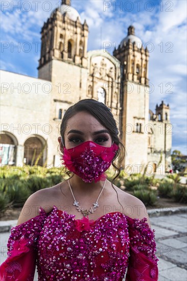 Beautiful dressed girl before the Church of Santo Domingo de Guzman