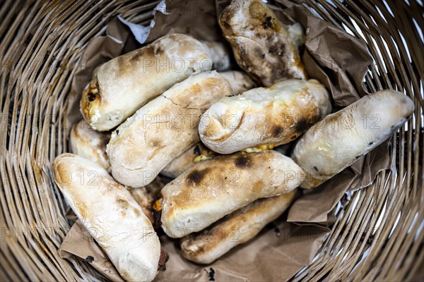 Traditional bread rolls with cheese and chorico meat baked in wood-fired oven