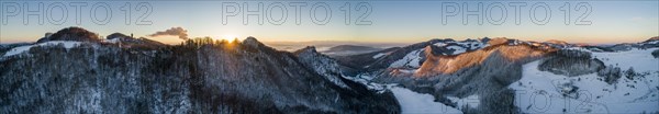 Sunrise at the Frohburg castle ruins and Geissflue summit cross