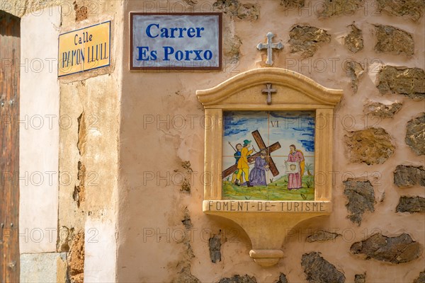 Road sign and Station of the Cross