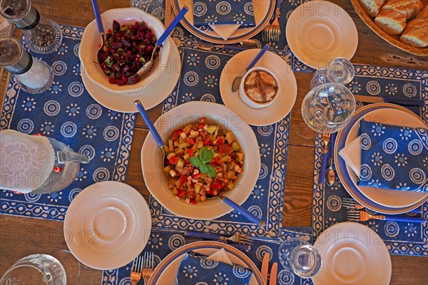 Decorated table with blue and white placemats
