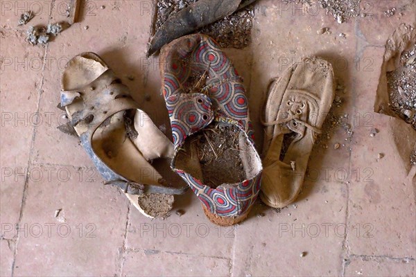 Shoe find of a Spanish house on terracotta floor from above