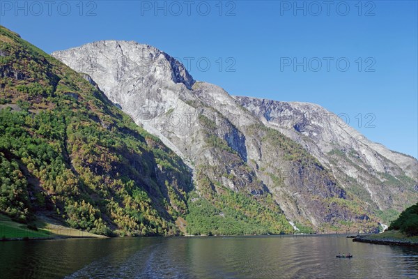 Kayakers in front of high cliffs