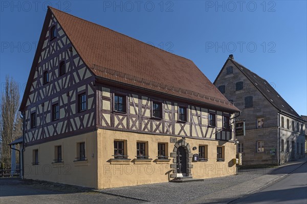 Historic half-timbered house and sandstone house from 1727