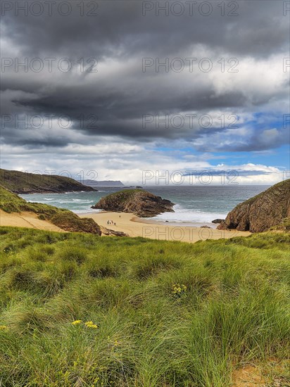 View of rocky coast with sandy beach