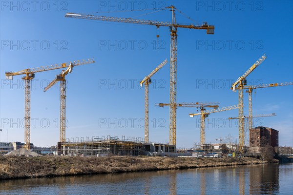 Construction cranes at the Europacity developing area on Berlin's Landwehrkanal