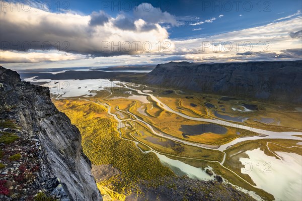 View from mountain Skierffe to the autumnal river delta Rapadalen