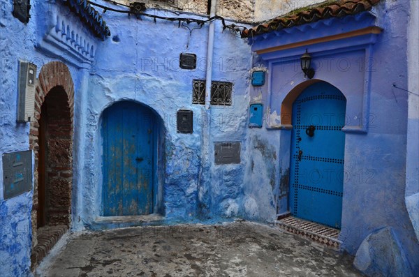 End of an alley with three house entrances