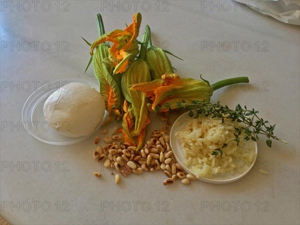 Courgette flowers with toasted pine nuts and mozarella ball