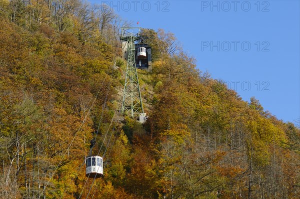 Cable car up the large castle hill in autumn