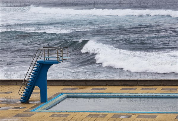 Swimming pool with diving tower on the Atlantic coast