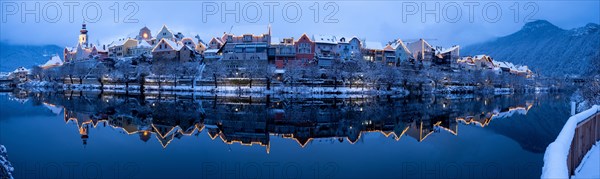 House facade of Frohnleiten reflected in the river Mur