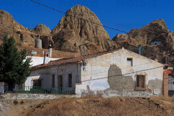 White cave houses in cave district of Guadix