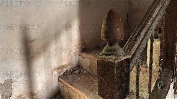 Marred knob of a staircase railing