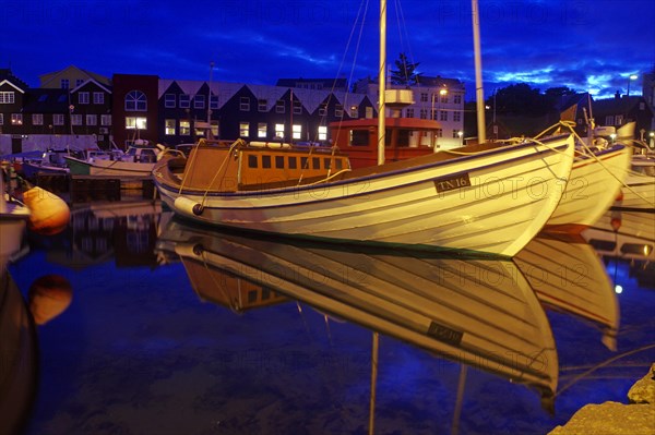 Old houses reflected in the harbour basin