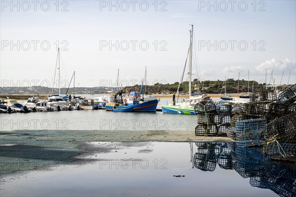 Fishermen's harbor with yachts and octopus traps in Alvor