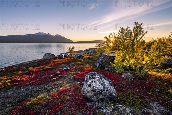 Autumnal fell landscape with lake Akkajaure and mountain range Akka