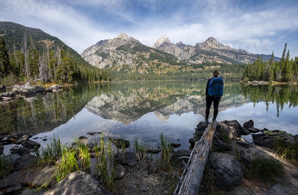 Young woman standing at a lake