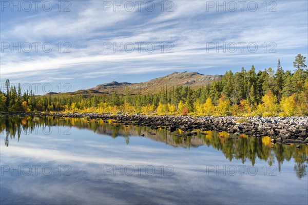 Reflection of an autumnal fell landscape