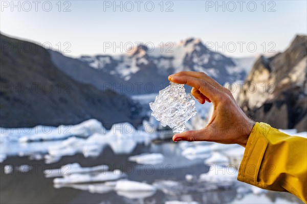 Hand holding glacial ice