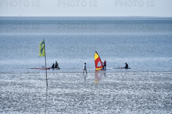 People on the edge of the Wadden Sea