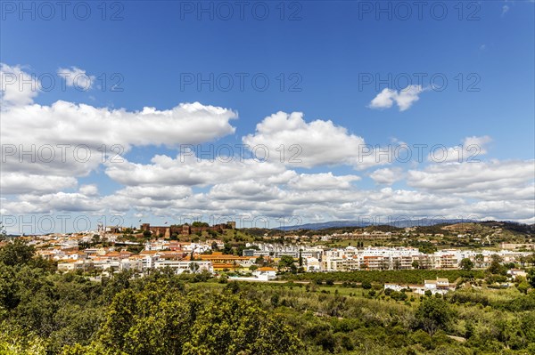 Silves cityscape with Moorish castle and cathedral on the top of the hill