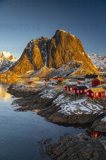 Scandinavian landscape with boathouses at the fjord