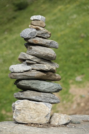 Stone pyramid on the hiking trail