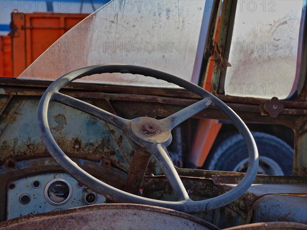 Handlebar and broken window of old truck