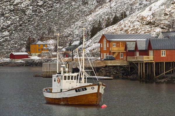 Fishing harbour in Scandinavian landscape with boathouses